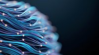 Glowing blue and white optical fibers in motion creating abstract wave pattern against dark background, modern technology concept for telecommunications.