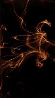Abstract golden flowing ribbons with sparkling particles on black background for luxury design projects and elegant presentations.