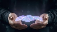 Male hands cupping glowing purple energy waves against dark starry background for technology, healing, and spiritual concepts.