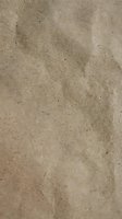 Natural brown sand texture background with fine grains and organic patterns for construction, beach themes, and earth-tone design projects.
