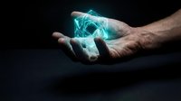 Male hands holding glowing turquoise energy orb with electric lightning effects on dark background for futuristic technology concepts.