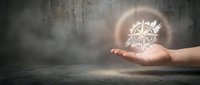 Glowing geometric crystal structure floating above open palm in dark atmospheric setting with dramatic lighting and mystical energy effects.