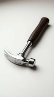 Professional claw hammer with wooden handle on neutral background for construction and carpentry projects.