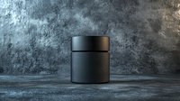 Black matte cosmetic jar on dark textured background with dramatic lighting, mockup for luxury skincare product presentation.