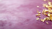 Mauve velvet surface with scattered gold leaf flakes creating elegant texture and sparkle, suitable for luxury backgrounds, invitations, and premium design projects.