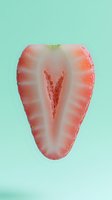 Fresh sliced strawberry half floating on mint green background shows juicy red flesh and white inner pattern, macro food photography for healthy eating concepts.
