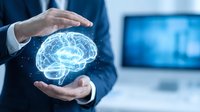 Businessman in suit holding glowing digital brain hologram, representing artificial intelligence, neural networks, and innovative technology solutions for business applications.