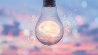 Light bulb with glowing brain inside, symbolizing creativity, innovation, and intelligent ideas. Soft bokeh background with magical swirls represents inspiration and problem-solving for business and education.