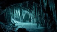 Frozen ice cave with towering icicles hanging from ceiling and walls, creating a magical winter wonderland landscape. Ideal for nature, travel, and seasonal design projects.