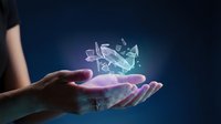 Young adult hand holding glowing holographic crystal shards floating above palm against dark blue background. Futuristic technology and innovation concept for digital transformation, science fiction, and modern design projects.