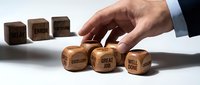 Businessman hand arranging wooden dice with positive words great job, well done, excellent, replacing negative delay, error, inefficient.
