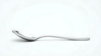 Single stainless steel spoon isolated on white background for kitchen utensil design projects and culinary presentations.