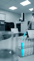 Laboratory pipette with blue liquid sample in test tube rack with modern scientific equipment and sterile white research facility background.