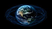 Planet Earth with satellite orbits visualization showing blue trajectory lines against dark space background, North and South America visible on globe surface.