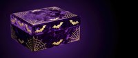 Purple Halloween gift box with golden bats and spider web pattern on dark background for seasonal decorations and spooky holiday celebrations.