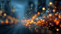 Abstract bokeh lights with warm golden orange glow and cool blue tones creating magical atmosphere for backgrounds and digital art projects.