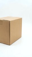 Brown cardboard shipping box isolated on white background for delivery and packaging design projects.