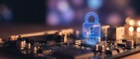 Digital security concept with glowing blue padlock hologram on computer circuit board representing cybersecurity and data protection technology.