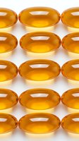 Golden amber gel capsules arranged in organized rows on white background, representing vitamins, supplements, medicine, and healthcare products for pharmaceutical and wellness industry use.