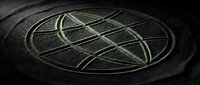 Intricate geometric sacred symbol carved into dark stone surface, featuring interlocking circles and lines forming spiritual mandala pattern for meditation and wellness design projects.