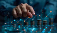 Male hand pointing at growing financial chart over stacks of coins with glowing network connections in dark blue background, representing investment growth.