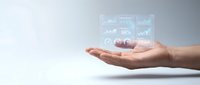 Business professional hands presenting holographic financial data analytics dashboard with charts and statistics for corporate presentations.