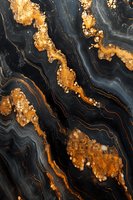 Luxurious black and gold marble texture with flowing veins and crystalline formations creates dramatic natural pattern for luxury interior design background.