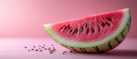 Juicy watermelon slice with scattered seeds on pink background, fresh summer fruit with bright red flesh and green rind showing natural texture and detail.