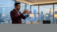 Professional businessman using futuristic holographic interface technology in modern office with city skyline view during evening hours.