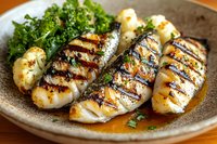 Grilled chicken breast with herbs and roasted potatoes served on rustic ceramic plate. Healthy protein meal with fresh garnish for restaurant menu design.