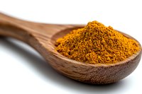 Ground turmeric powder heaped in wooden spoon against white background, bright orange-yellow color and fine texture shows fresh aromatic spice for cooking.