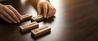 Hands arranging wooden blocks with checkmark and rejection symbols on dark surface, representing decision-making, quality control, approval process, and business evaluation concepts.