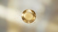 Golden oil drop with splash droplets on blurred cream background for cosmetic skincare and beauty product applications in advertising and marketing.