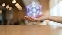 Hand holding glowing purple geometric holographic molecular structure with hexagonal nodes against blurred office background, representing technology, innovation, science, and digital transformation.