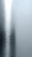 Brushed metal surface with polished steel texture and light reflection, suitable for industrial backgrounds and modern design projects.