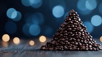 Pyramid shaped pile of roasted coffee beans on dark surface with blue and gold bokeh lights in background creating magical coffee atmosphere.