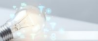Glowing light bulb with digital innovation icons and network connections on white background representing creative ideas and technology solutions.