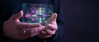 Businessman hands holding transparent digital tablet displaying colorful network connections and data visualization for modern technology presentations.