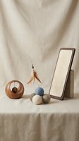 Cat scratching post with toys and feather wand on neutral linen background for pet care and feline entertainment accessories.