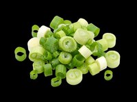 Chopped and sliced green onions isolated on transparent background, ready for culinary design projects, recipe graphics, food packaging, cooking blogs, restaurant menus, and print-on-demand kitchen products.
