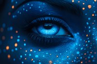 Mystical blue eye with glowing particles and cosmic energy effects creating magical fantasy atmosphere for digital art and creative projects.