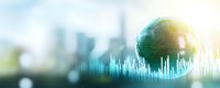 Green globe with digital data visualization and financial charts against blurred city skyline background for business analytics and global economy concepts.