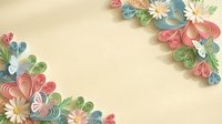 Quilled paper flowers in pastel colors creating decorative corner borders on cream background for crafting and greeting card designs.