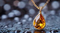 Elegant teardrop citrine pendant necklace with golden chain on dark reflective surface with bokeh lights, showcasing luxury jewelry craftsmanship and gemstone detail.