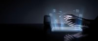 Hands interacting with glowing digital tablet displaying connected icons and network symbols, representing technology, innovation, and digital transformation in business and communication.