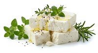 Fresh white cheese cubes with herbs and spices on white background. Dairy product with oregano, rosemary and black pepper isolated for culinary design.