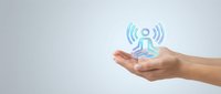 Hands presenting wireless network connectivity symbol with radio waves on clean background for technology and communication concepts.