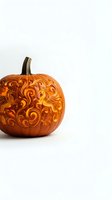 Intricately carved pumpkin with ornate floral scrollwork patterns glowing from within, isolated on white background for autumn and Halloween designs.