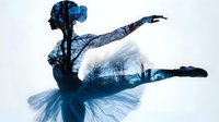 Graceful ballerina silhouette with double exposure effect showing winter forest branches in blue tones, dancer in tutu performing grand jete leap against white background.