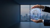 Business professional hands protecting glowing digital globe with network connections in modern office environment for technology concepts.